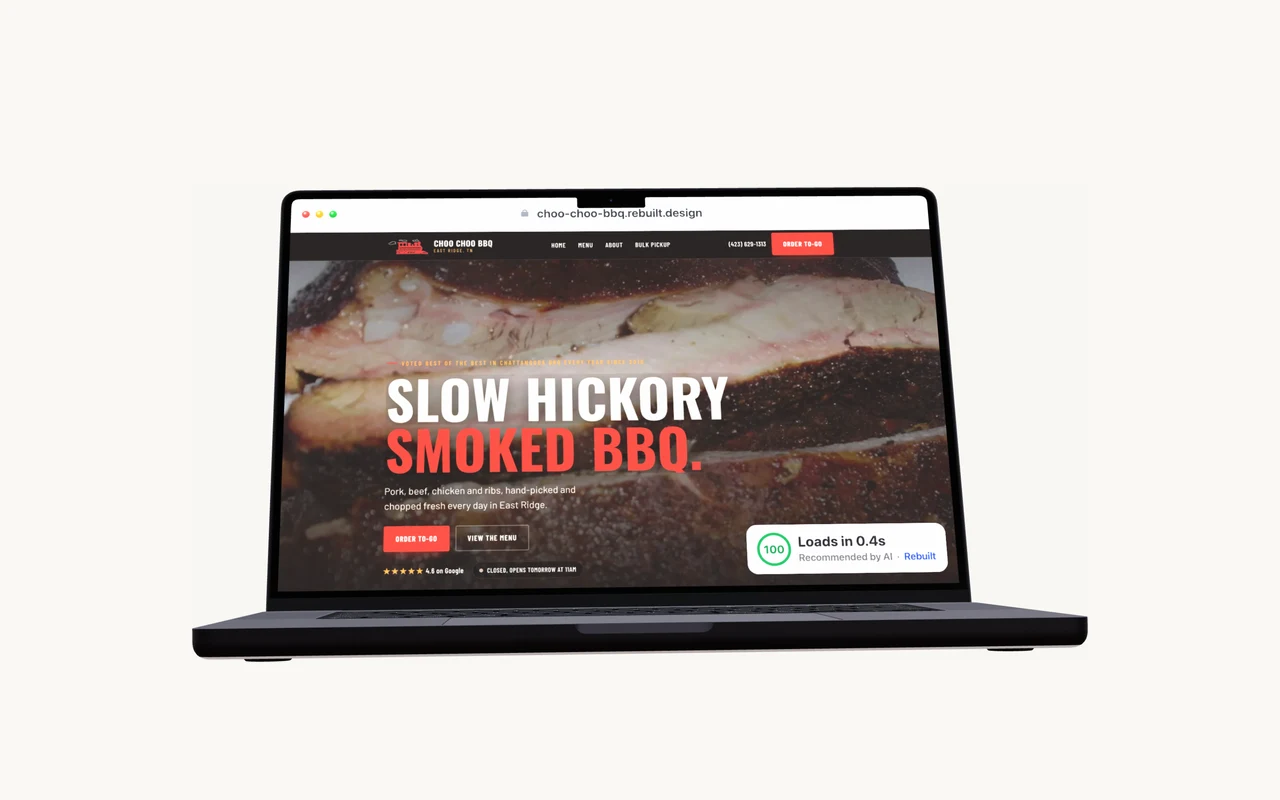 An open MacBook showing a real rebuilt local-business website.